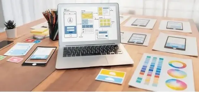 Developer coding UI/UX design for mobile app development on laptop